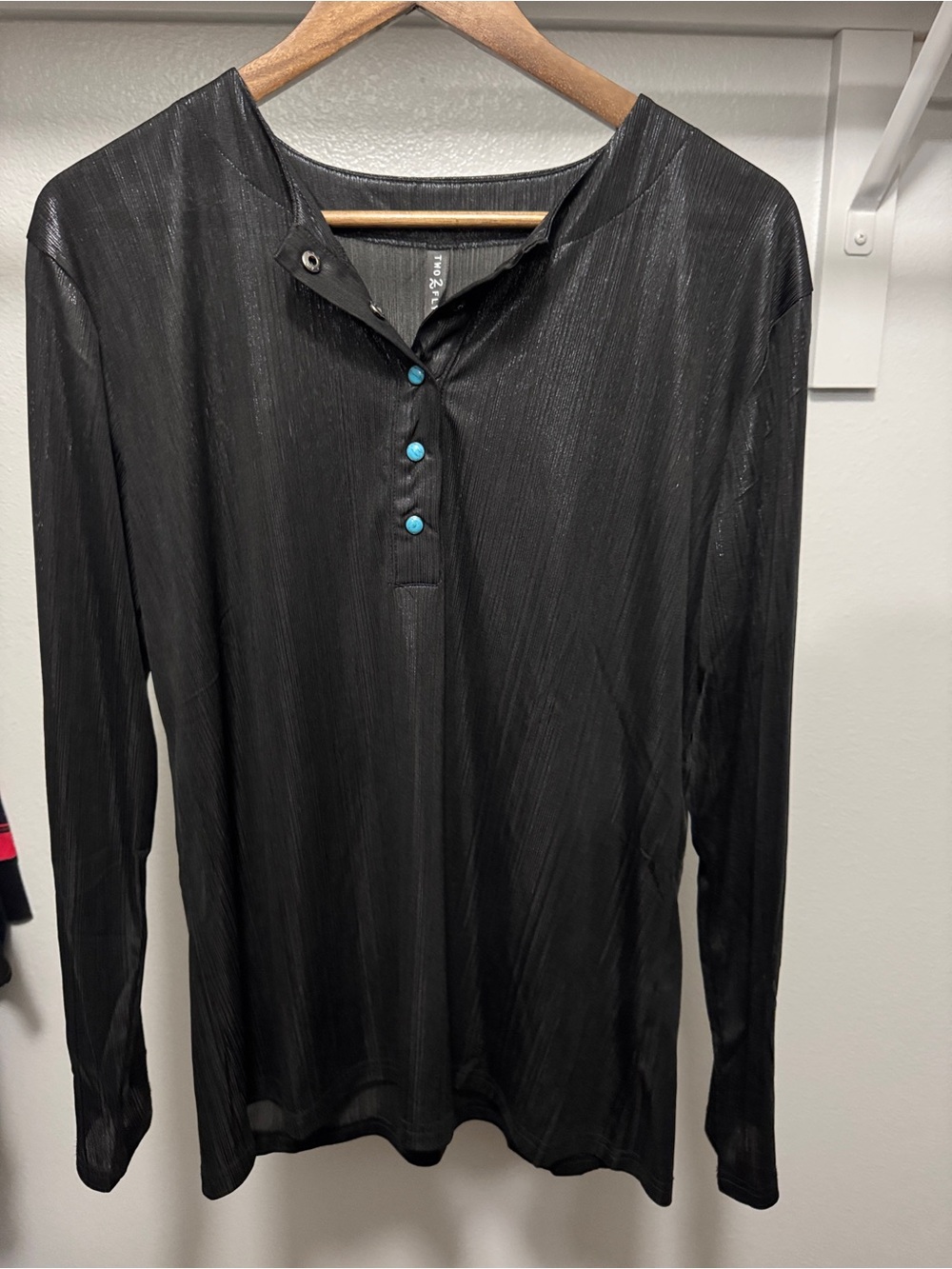 2 fly Black Long-Sleeve top with turquoise buttons